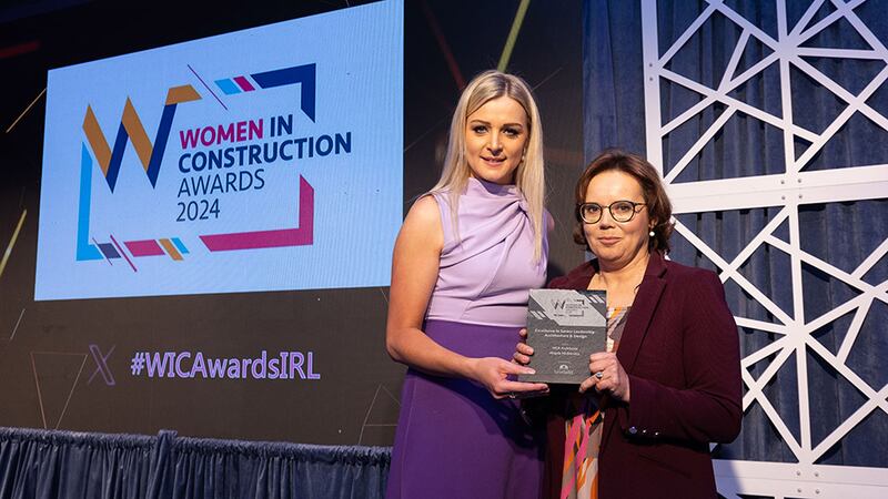 Ruth Heeney, finance director, Bretland, presents the excellence in senior leadership - architecture and design award to Magda Mickiewicz , MCA Architects