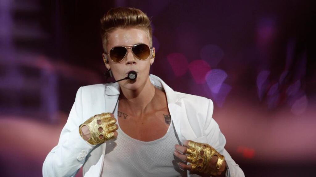 Justin Bieber is seen performing in  Lisbon in  March and claimed the  media ‘make up a lot of lies’. Photograph: Reuters