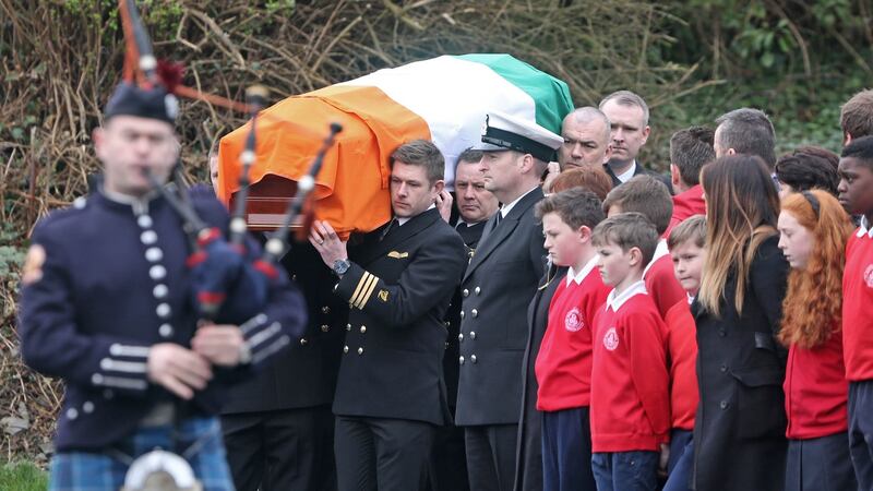 A piper and guard of honour accompany the coffin carrying the remains of Capt Mark Duffy at St Oliver Plunkett Church, Blackrock, Co Louth, this morning, where his funeral Mass was held. Photograph: Colin Keegan/Collins Dublin