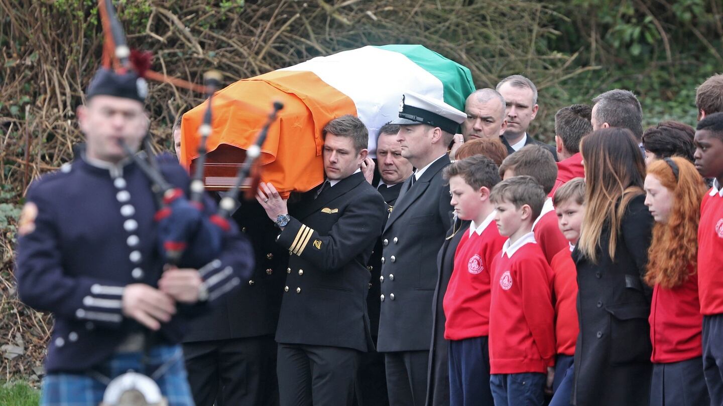 A piper and guard of honour accompany the coffin carrying the remains of Capt Mark Duffy at St Oliver Plunkett Church, Blackrock, Co Louth, this morning, where his funeral Mass was held. Photograph: Colin Keegan/Collins Dublin