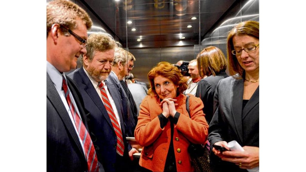 Minister for Health James Reilly, Minister of State Kathleen Lynch, Roy Browne of Phoenix Care Centre and HSE manager Anne O'Connor wait in the stuck lift. photograph: brenda fitzsimons
