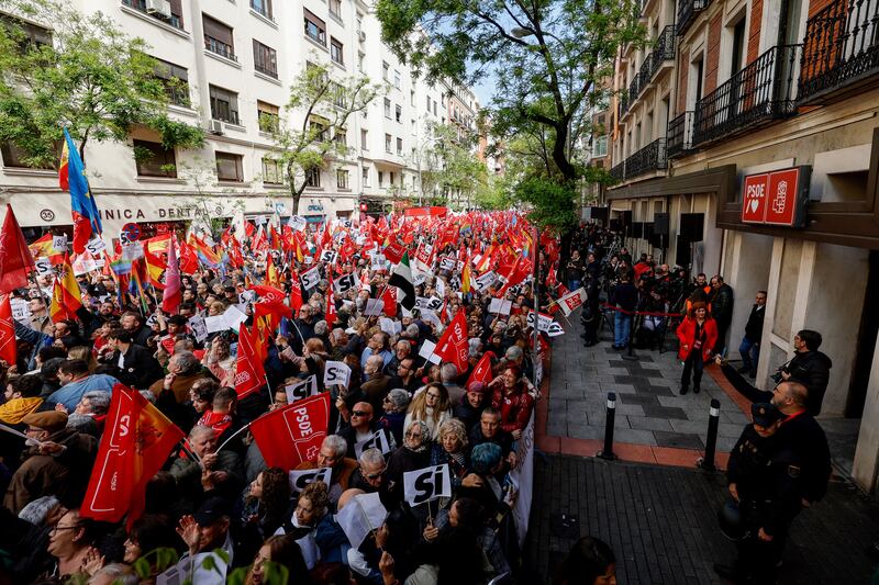 Supporters wave flags as they gather during a demonstration called in support of the Spanish prime minister. Photograph: by Oscar Del Pozo/AFP via Getty Images)