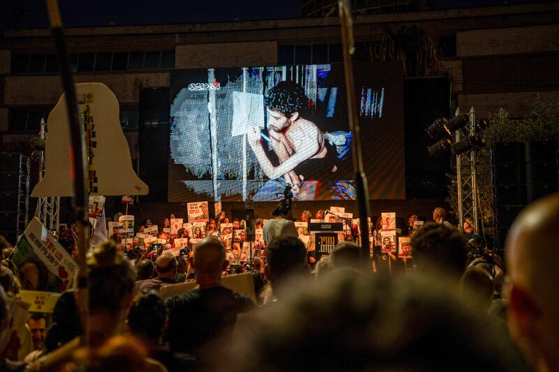 Families of hostages at a Tel Aviv, Israel, rally on Saturday watch a video by Hamas showing Evyatar David, an Israeli hostage, in a severely malnourished condition. Photograph: Ori Aviram/Middle East Images/AFP via Getty Images