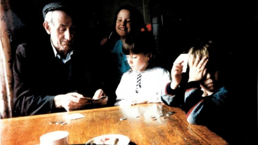 Tea and cards: Emma Somers (in white) with her grandfather, Michael Somers, and her cousins Lisa and Tom O’Riordan. Photograph: Mary Somers