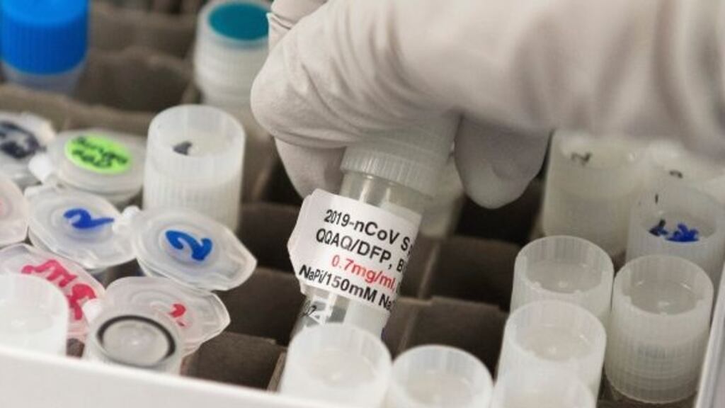 Dr Nita Patel, director of antibody discovery and vaccine development, lifts a vaccine vial at Novavax’s labs in Maryland. Photograph: Andrew Caballero-Reynolds/AFP via Getty Images