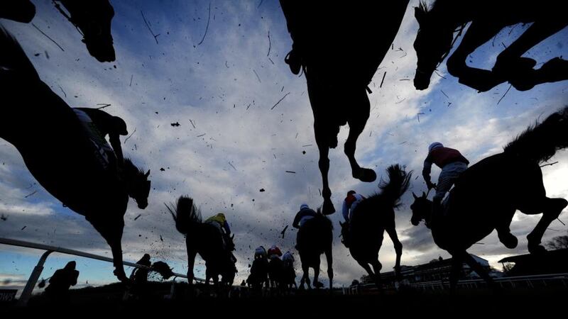 Runners clear a fence in The Coral Welsh Grand National at Chepstow. Photograph: Alan Crowhurst/Getty Images