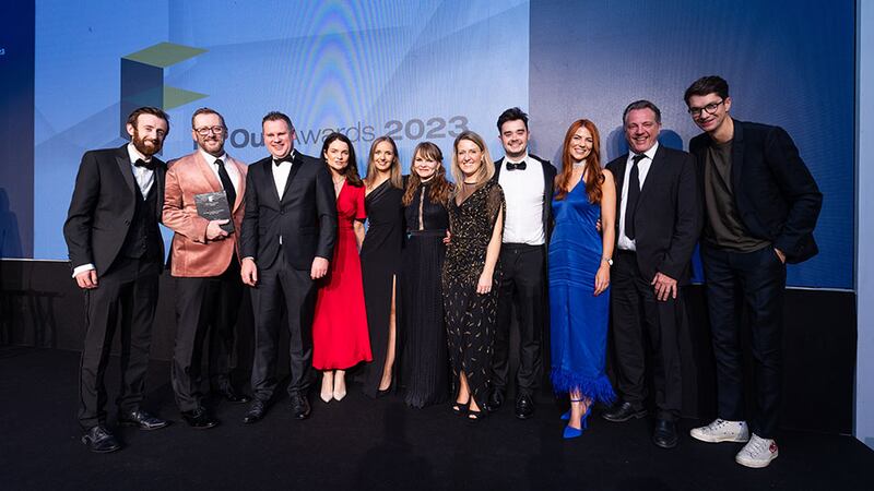 Tomás Mac Eoin, managing director at McKeon Group, presents the fit out design practice of the year award to Perkins&Will team