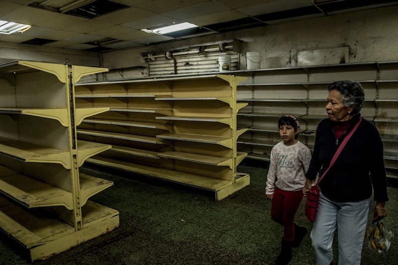 Food shortages have led to empty supermarket shelves in Venezuela, including these in Guaicaipuro.
