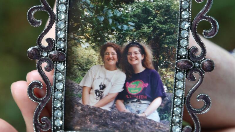 Maura McHugh holds a photograph of herself and her sister Anne, who died in the 9/11 attacks on the World Trade Center. Photograph: Joe O’Shaughnessy