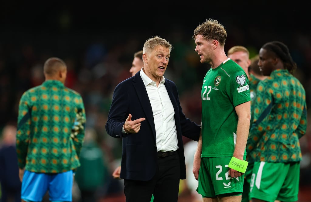 Republic of Ireland manager Heimir Hallgrímsson speaks with captain Nathan Collins after the game. Photograph: James Crombie/Inpho