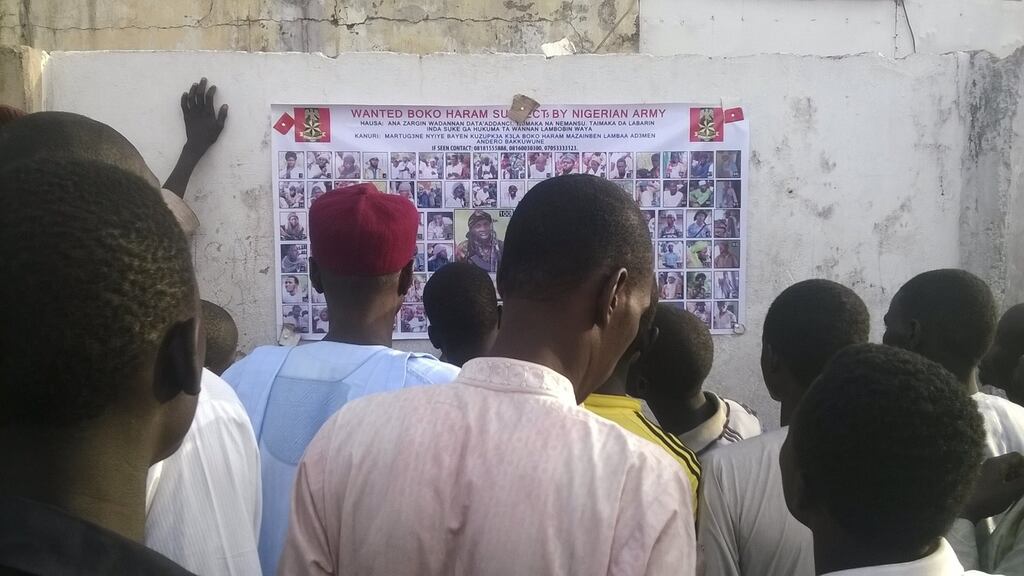 Locals view photographs of wanted Boko Haram suspects on a notice posted by the Nigerian military in Maiduguri, Borno State, Nigeria, on November 13th. Photograph: Reuters