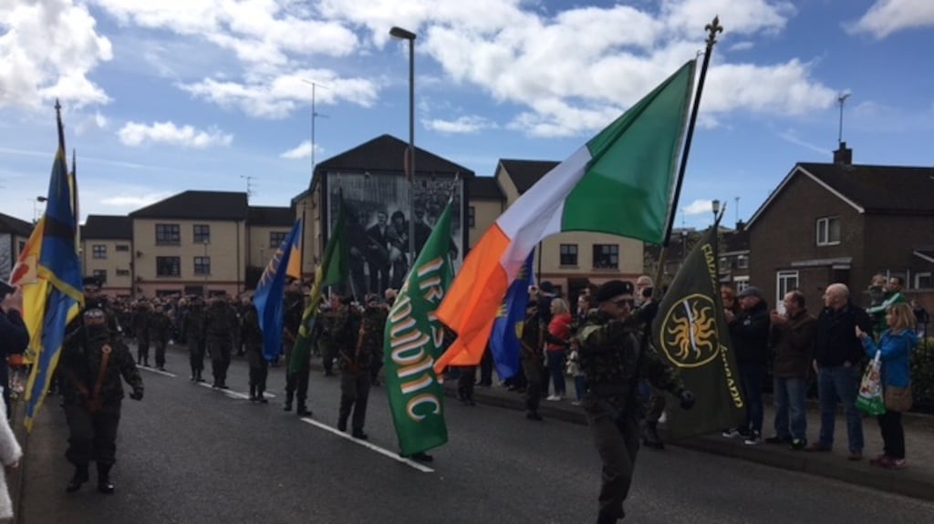 Men and women in paramilitary uniforms parade through the Bogside area of Derry on Monday as part of a dissident republican Easter Commemoration. Photograph: Freya McClements