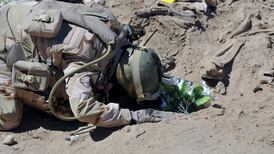 Teams excavate mass graves of Iraqi soldiers killed by IS