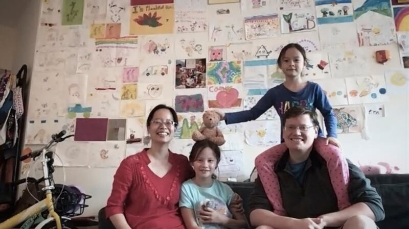 Priscilla Song, her husband, Joseph Walline, and their two daughters, Camy and Linnaea, shortly after cutting off their wristbands at the end of their 14-day quarantine. Photograph: Christina Simons for The New York Times