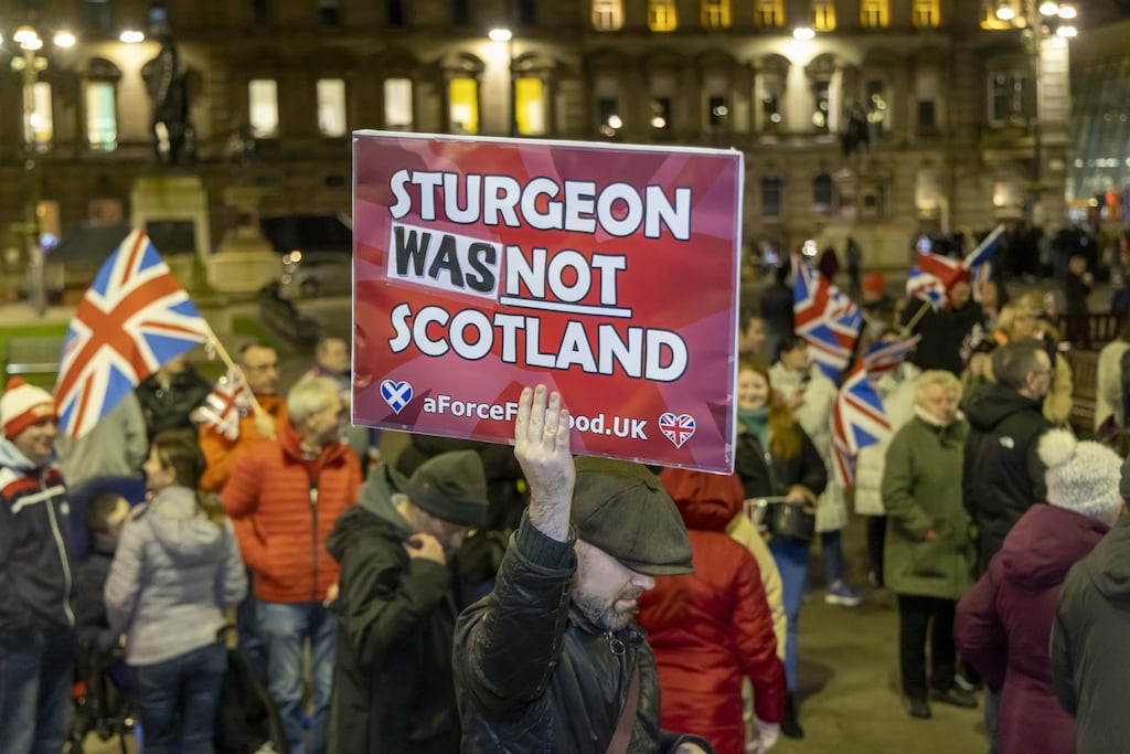 Unionist supporters as they celebrate the resignation of First Minister and leader of the SNP Nicola Sturgeon, in George Square, Glasgow, Scotland, 15 February 2023.