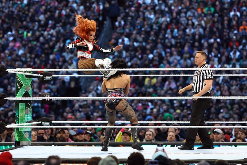 Becky Lynch fights Rhea Ripley during a match for the WWE Women's World Championship. Photograph: Tim Nwachukwu/Getty