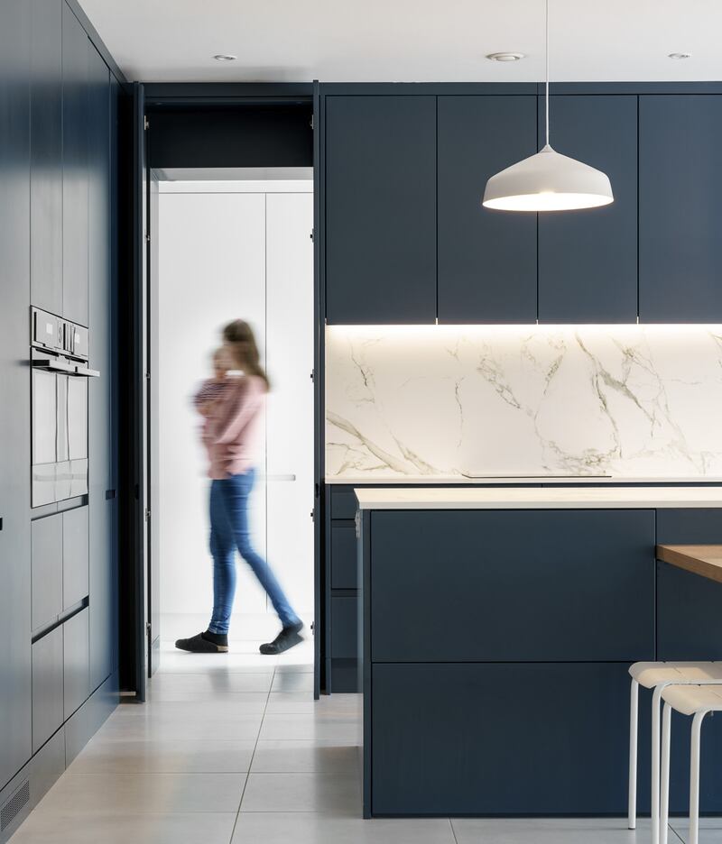 Create a seamless aesthetic streamlining your space by designing the hidden door to blend in with your kitchen units. Photograph: Donal Murphy