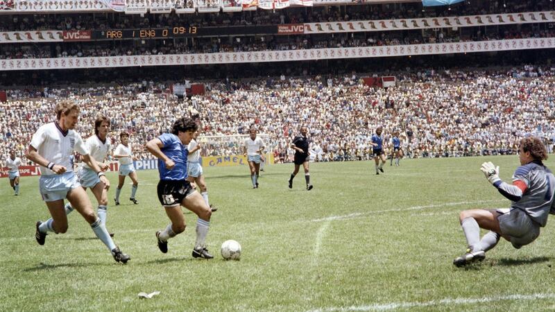 Diego Maradona goes past Peter Shilton on his way to scoring the second goal. Photograph: Getty Images