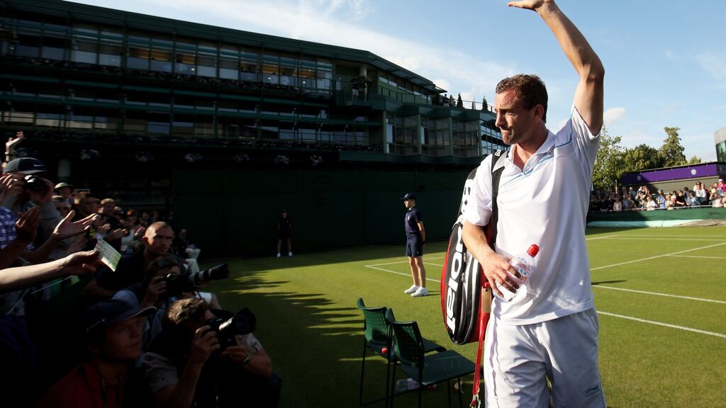 Conor Niland of Ireland waves to the crowd as he walks off court after losing his first round match to Adrian Mannarino in 2011. Photo: Getty Images