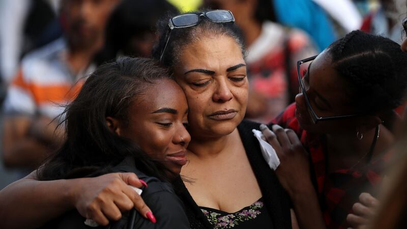 People attend a vigil at Notting Hill Methodist Church near Grenfell Tower. The number of fatalities is expected to rise. Photograph: Dan Kitwood/Getty Images