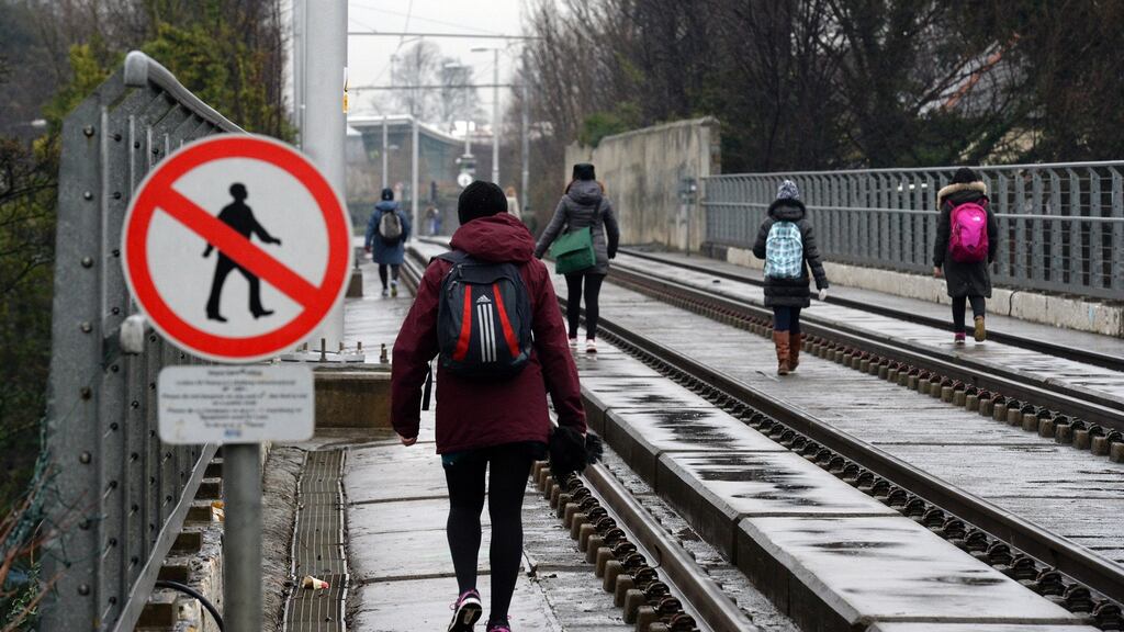 People walking the Luas line near Milltown during a Luas drivers’ strike. File photograph: Cyril Byrne/The Irish Times