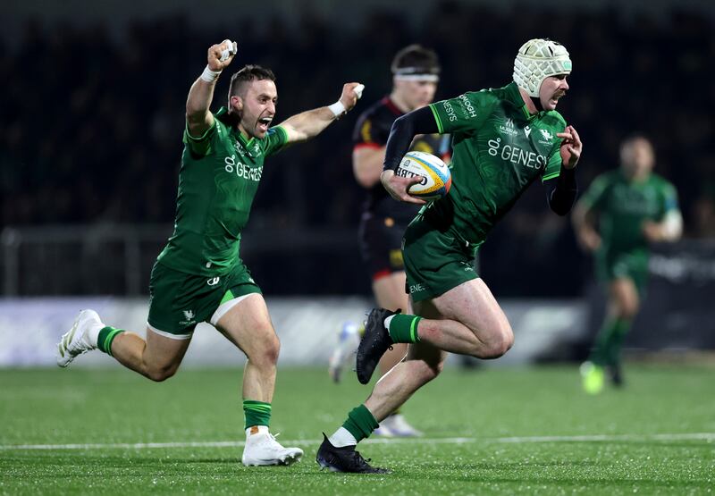 Mack Hansen scores a try for Connach as Caolin Blade celebrates. Photograph: James Crombie/Inpho