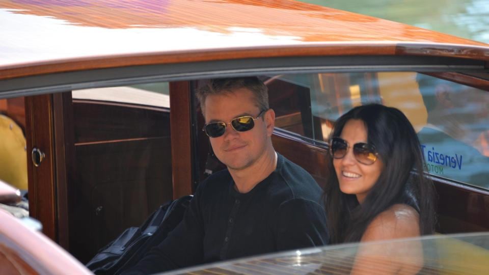 US actor Matt Damon (C) and his wife Luciana Barroso (R) get on board of a boat after landing at Nicelli airport, at Venice Lido, Italy, today. Photograph: Andrea Merola/EPA