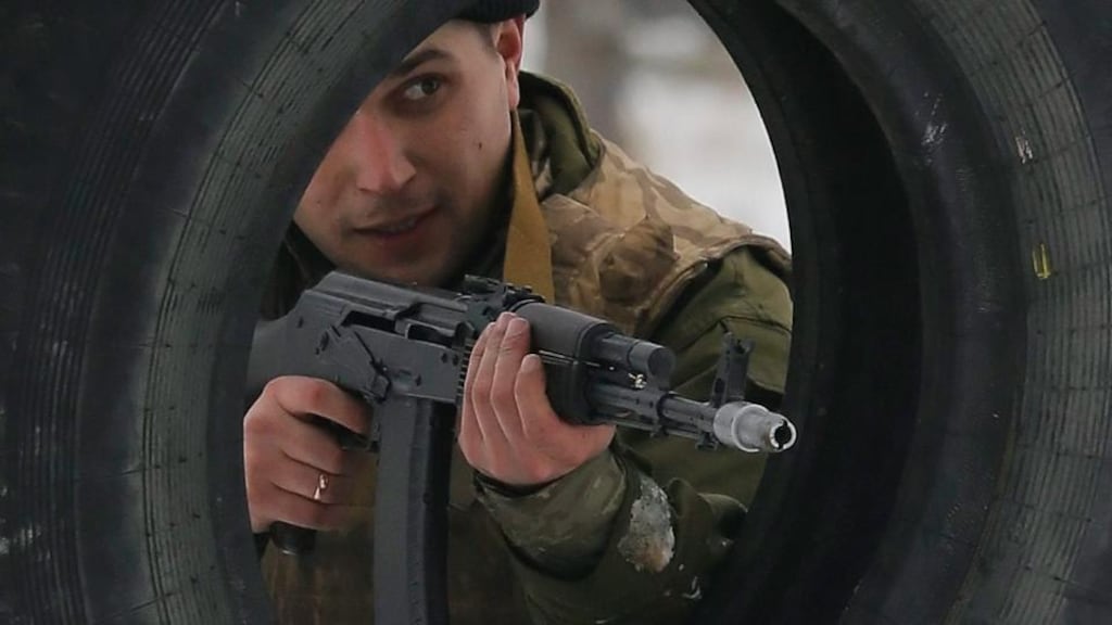 A recently mobilized Ukrainian serviceman aims his rifle during a military training on the Desna shooting range in Ukraine. Photograph: Sergey Dolzhenko/EPA