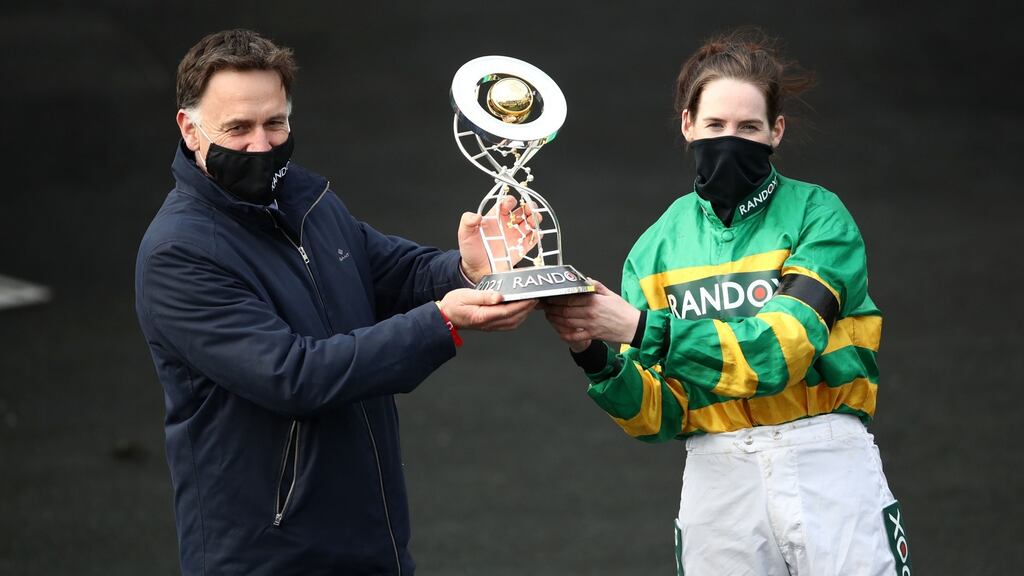 Rachael Blackmore and trainer Henry De Bromhead celebrate with the trophy after winning the Randox Grand National Handicap Chase at Aintree Racecourse. Photograph: Tim Goode/PA Wire