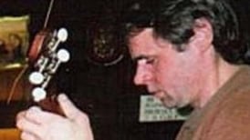 Musician stabbed in neck while sitting or slumped, murder trial hears