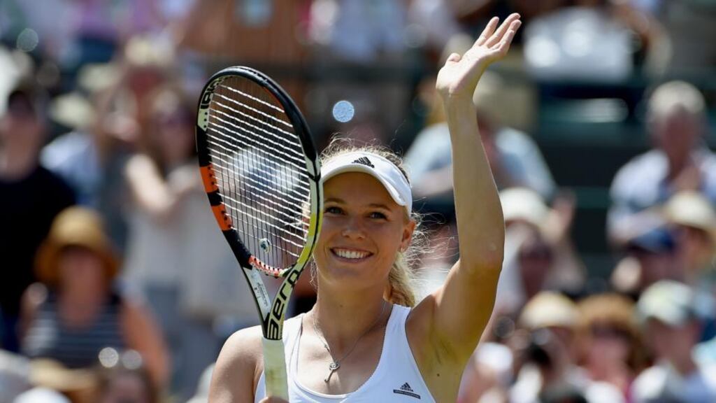 Caroline Wozniacki has matched her best Wimbledon performance after she beat Camila Giorgi in straight sets to reach the fourth round. Photograph: Epa