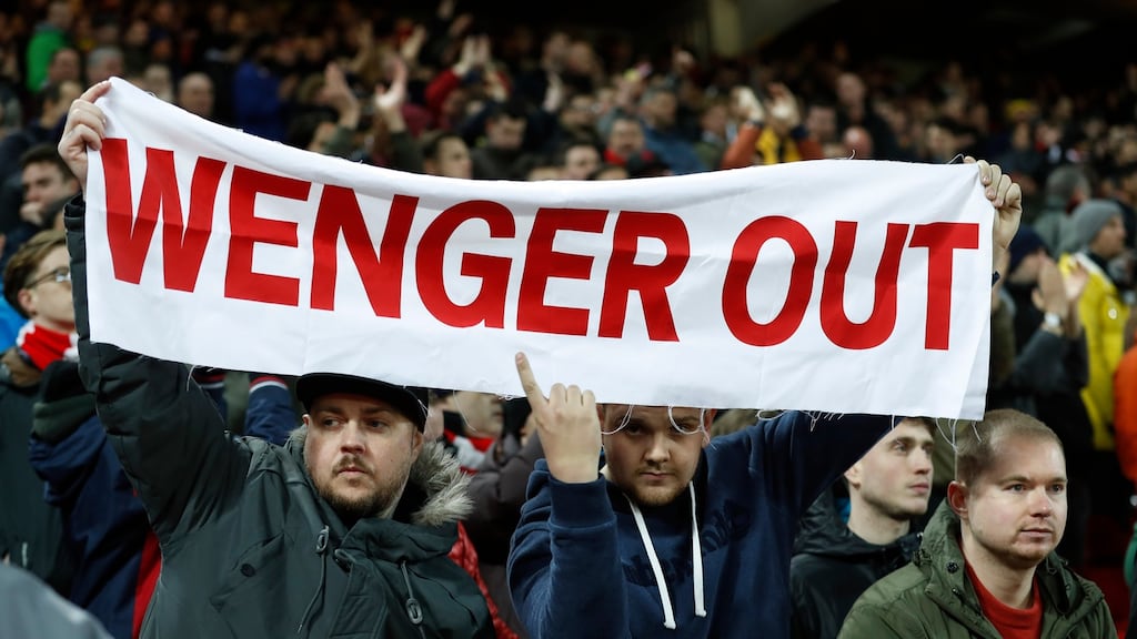 Arsenal fans protest with a banner against manager Arsene Wenger during their Premier League clash with Liverpool. Photo: Lee Smith/Reuters