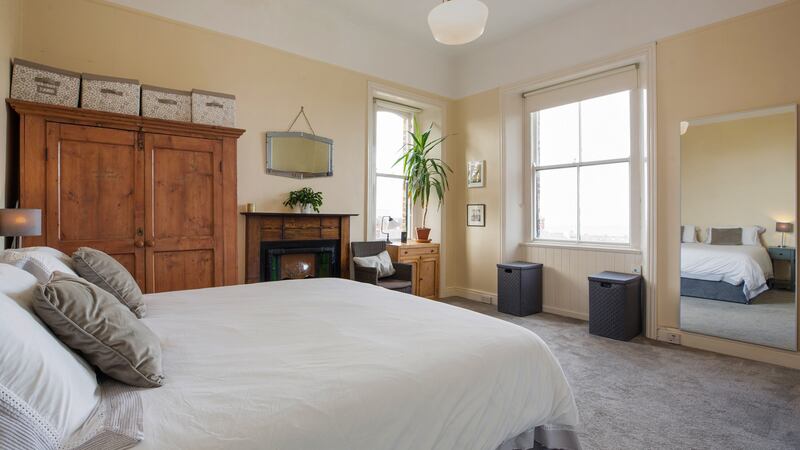 Bedroom with dual aspect and original fireplace