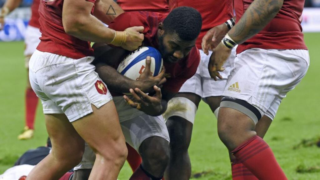 France’s winger Noa Nakaitaci is congratulated by teammates after scoring a try at the Stade de France Photograph: AFP PHOTO