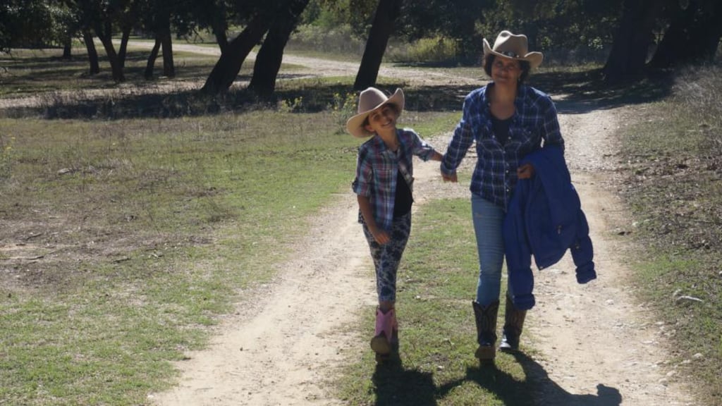 Learning to live a cowboy life: Sarah McKevitt with her daughter Izzie in Houston.