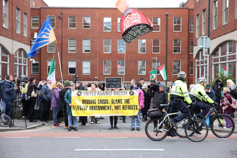 Protesters outside the International Protection Office on Mount Street: Asylum seekers 'should be given accommodation at the very bare minimum and be treated with dignity and humanity'. Photograph: Dara Mac Dónaill