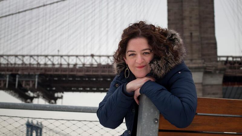 ‘The idea of this country is one thing, and the reality is another.’ Comedian and writer Maeve Higgins, who has lived in the US for three years, beside the Brooklyn Bridge. Photograph by Michael Nagle