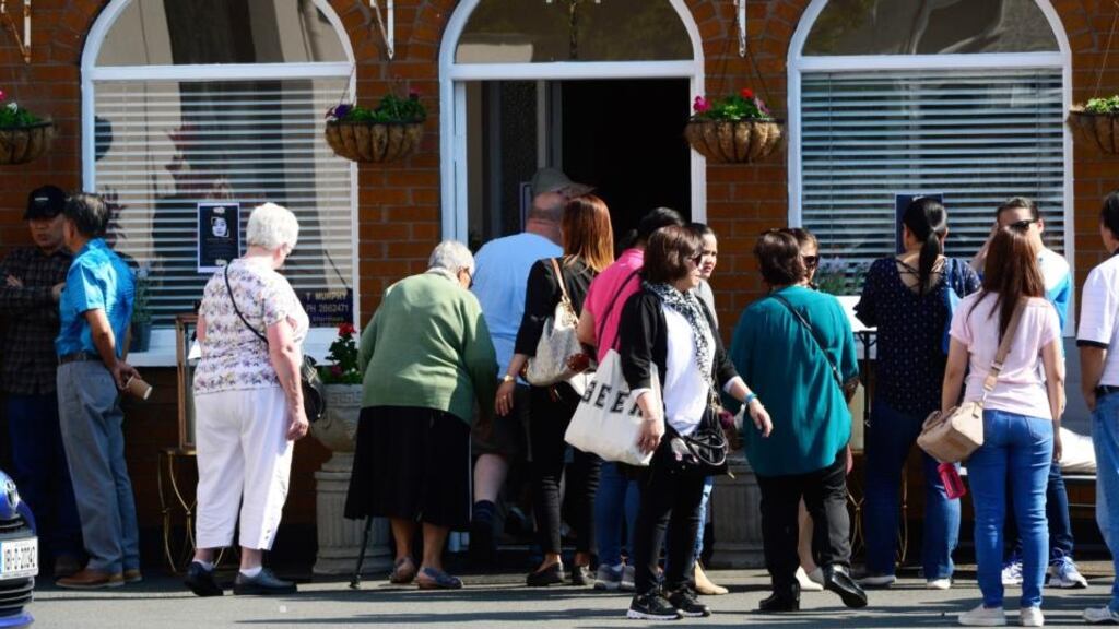 Members of Ireland’s Filipino community were among those who paid their respects to Jastine Valdez at a funeral home in Bray, Co Wicklow, on Friday. Photograph: Cyril Byrne