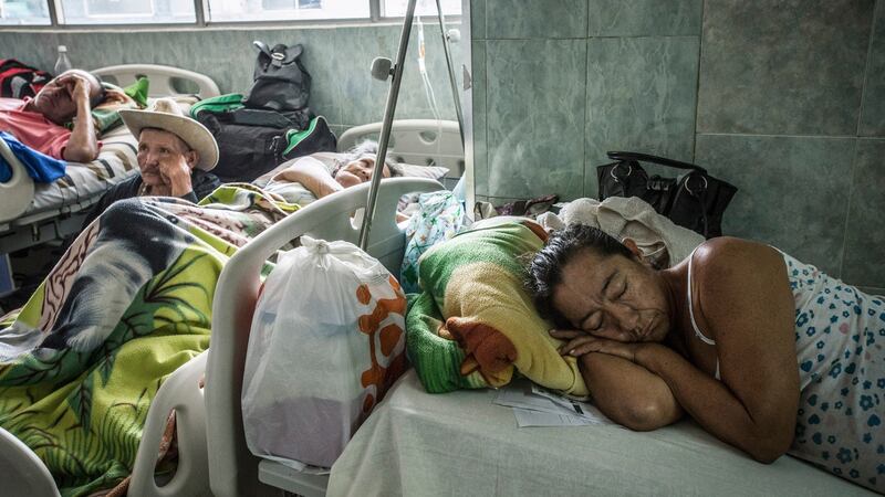 Patients rest in the hallways at the overcrowded public hospital in Merida, Venezuela. Photograph: Meridith Kohut/New York Times