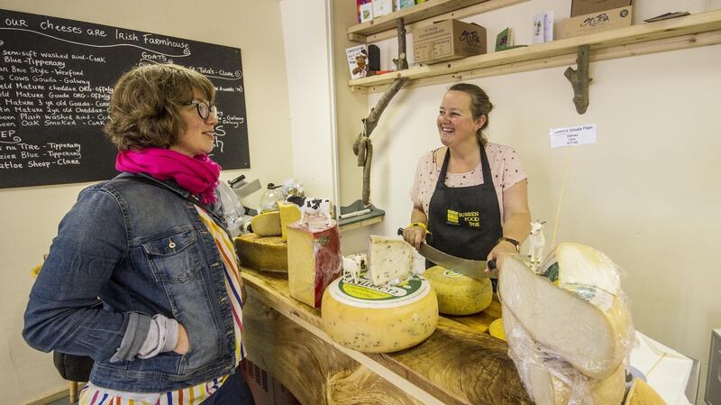 Sinéad Ní Gháirbhith serves a customer in The Cheese Press in Ennistymon, Co Clare