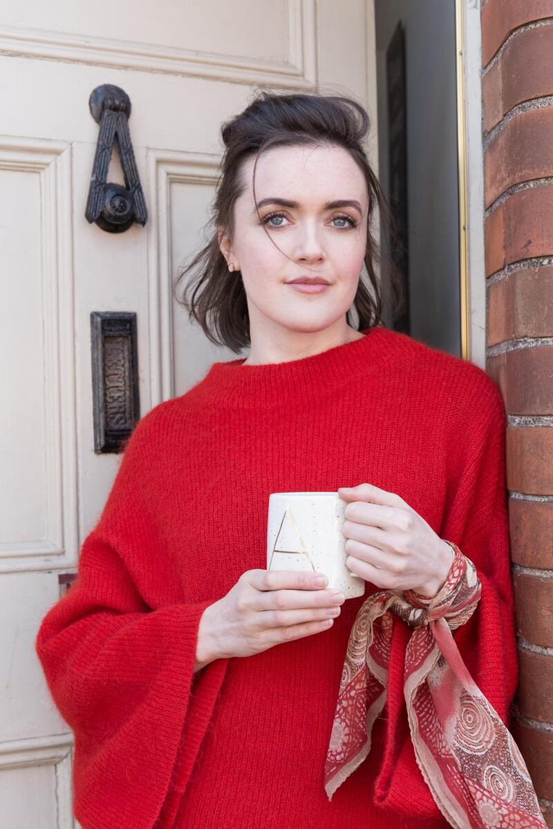 An H & M jumper with bell sleeves bought in a charity shop in Capel Street. The scarf belonged to her grandmother. Pic Pearl Phelan