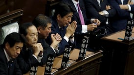 Japan enacts bills easing pacifist constitution’s limits on military