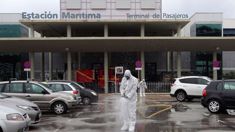 Members of Spain’s army emergency unit disinfect the port of Algeciras in southern Spain, on Thursday. 19 March 2020. Spanish faces its fifth day of lockdown to contain the spreading of coronavirus outbreak. EPA/A.Carrasco Ragel
