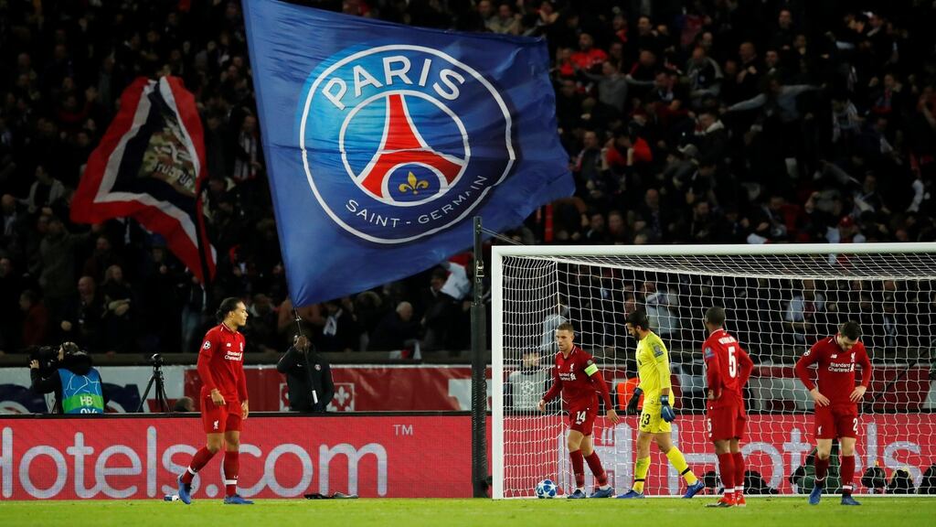 Liverpool’s Alisson, Virgil van Dijk and team mates look dejected after conceding a second goal to by Paris St Germain’s Neymar. Photograph:  Andrew Boyers/Reuters