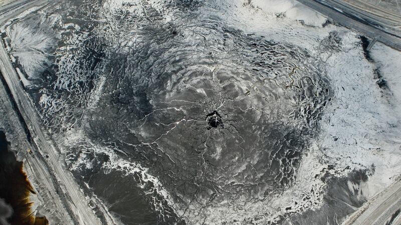An aerial photo shows a massive sinkhole that opened up underneath a gypsum stack at a Mosaic phosphate fertilizer plant. Photograph: AP