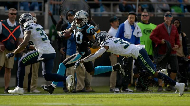 Tre Flowers of the Seattle Seahawks tackles Curtis Samuel of the Carolina Panthers. The Seahawks teach rugby-style tackling to their players. Photograph: Grant Halverson/Getty Images