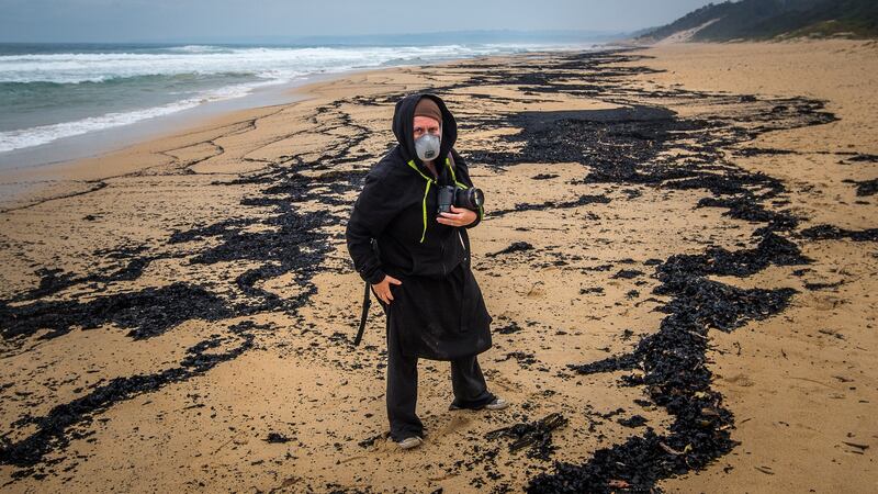 Photojournalist Rachel Mounsey records the dead birds that have washed ashore on the beaches of Mallacoota in New South Wales following horrendous bushfires. Photograph: Justin McManus/The Age via Getty Images