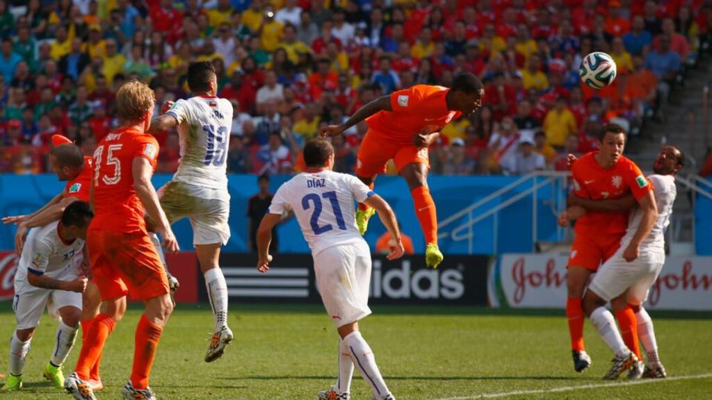 Leroy Fer scores  powers home his header against Chile. Photograph: Clive Rose/Getty Images
