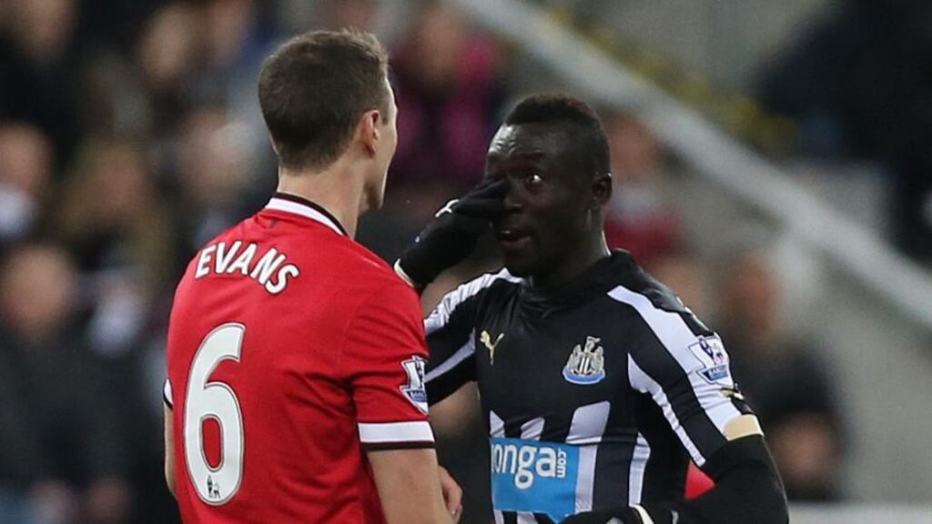 Manchester United’s Jonny Evans clashes with Newcastle’s Papiss Cisse. Photograph: Lee Smith/Reuters