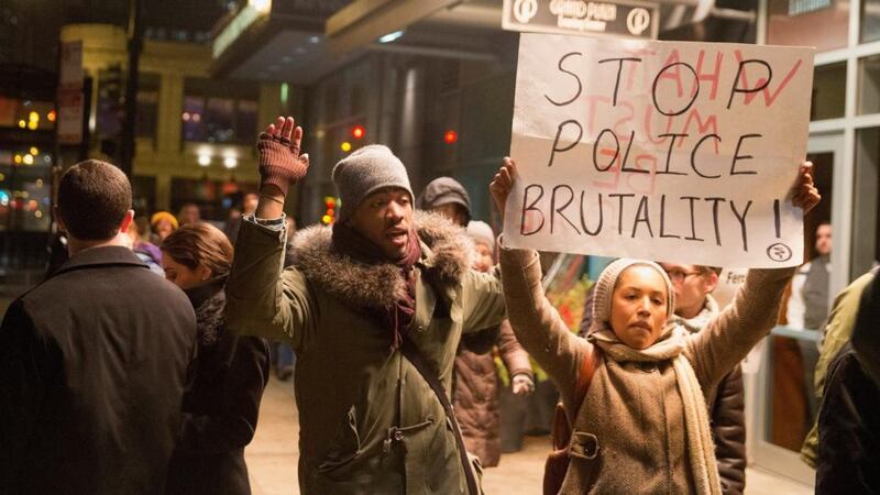 Protesters march through the Loop in Chicago against   police abuse. Photograph: Scott Olson/Getty Images